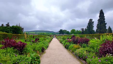 Powerscourt-Gardens-family-members-enjoy-the-walk-trough-the-walled-gardens,visitor-attraction-in-Wicklow-Ireland-Epic-locations-Gardens-family-members-enjoy-the-walk-through-the-walled-gardens