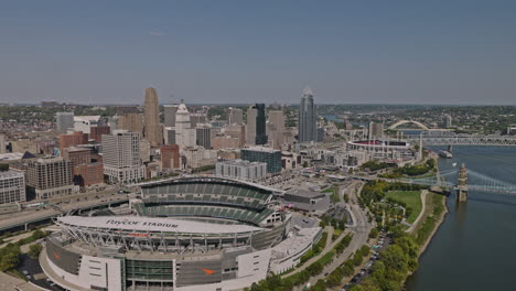 Cincinnati-Ohio-Aerial-v15-drone-flyover-along-the-shore-capturing-waterfront-Paycor-stadium,-freeway-traffics,-river-crossing-bridges-and-downtown-cityscape---Shot-with-Inspire-3-8k---September-2023