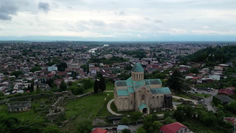 Captivating-4K-60fps-drone-shots-of-Bagrati-Cathedral-in-Kutaisi,-Georgia,-displaying-its-historic-and-architectural-splendor
