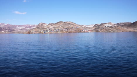 Ittoqqortoormiit-Village,-Greenland,-Offshore-View-of-Settlement-on-Sunny-Summer-Day