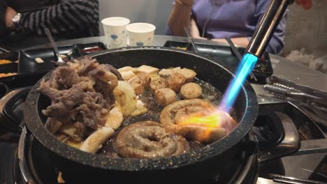 Experience-the-sizzling-spectacle-of-traditional-Korean-cooking-as-pork-internal-organs