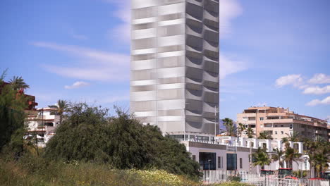 Viewpoint-tower-in-Estepona-city,-fast-tilt-up-view