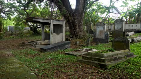 Neglected-by-time,-cemetery-tombs-decaying,-historical-religious-landmark