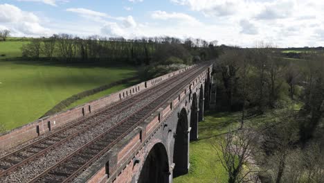 Drone-flight-along-Welland-Viaduct-Lincolnshire-on-bright-sunny-day-following-the-track