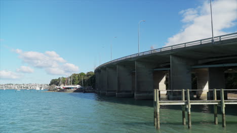 Cars-driving-over-Auckland-Harbour-bridge,-New-Zealand