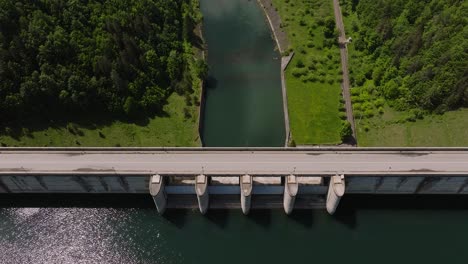 Dam-and-water-reservoir,-panoramic-aerial-top-view