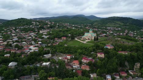 Stunning-4K-60fps-drone-footage-of-Bagrati-Cathedral-in-Kutaisi,-Georgia,-showcasing-its-medieval-architecture-and-scenic-surroundings
