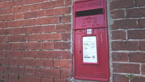 English-wall-mounted-letterbox-with-Queen-Elizabeth-crown-postal-times