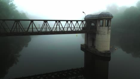 A-hazy-scene-with-an-abandoned-lock-over-calm-water