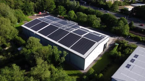 Aerial-view-solar-panels-on-roof-of-new-large-industrial-office-warehouse