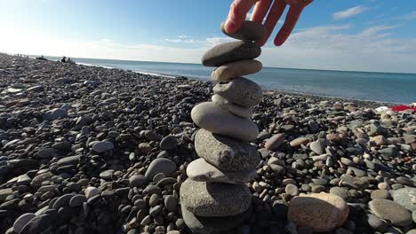 Tower-is-been-built-by-balancing-pebble-stones-on-top-of-each-other-until-they-collapse