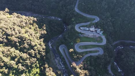 Stunning-aerial-view-of-the-Yunga-forest-and-Route-307-captured-by-a-drone,-showcasing-its-winding-roads-and-breathtaking-greenery
