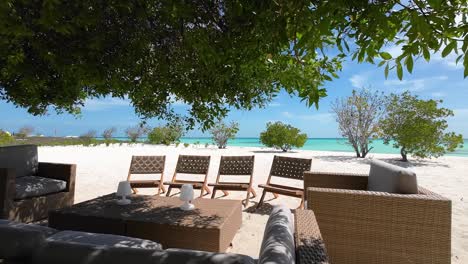 Dream-outdoor-space-ready-for-summer-season-with-table,-bench-and-chairs-beachfront-home,-Los-Roques
