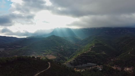 Sunbeams-break-through-clouds-over-Montserrat-and-Marganell-Mountains-in-Barcelona