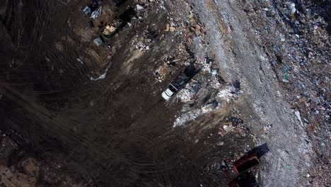 Aerial-View-of-Truck-Dumping-Garbage-at-Landfill-in-Calgary-SE