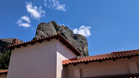 Sacred-monastery-of-rocks-view-from-below-temple-and-home-with-tiled-roof