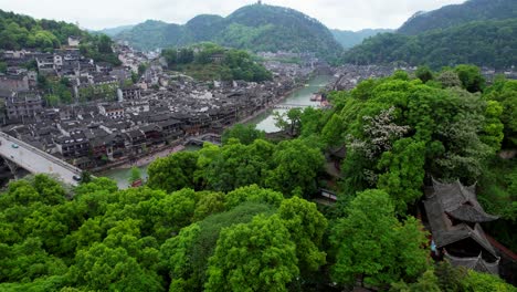 Aerial-view-of-Fenghuang-revealing-the-Ancient-Town-and-Tuo-Jiang-River,-China