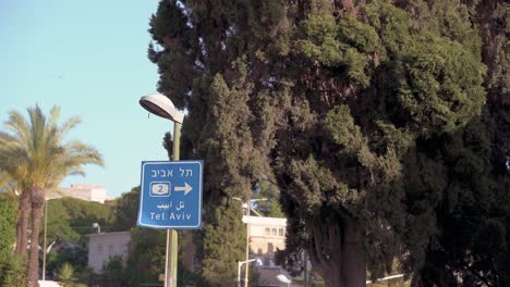 Road-sign-in-Israel,-Signs-are-written-in-Hebrew-and-Arabic,-the-two-official-languages-of-the-country,-and-in-English