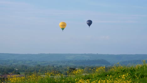 Thatchers-Cider-and-CJ-Hole-Estate-Agents-hot-air-balloons-flying-over-rural-countryside-landscape-of-the-Somerset-Levels