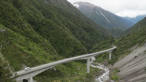 Mini-bus-riving-over-Otira-Viaduct-bridge-in-Arthurs-Pass-New-Zealand