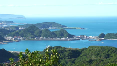 Panning-landscape-views-of-Shen'ao-fishing-harbor-and-Keelung-Islet-at-daytime-from-Jiufen-Old-Street-mountain-town,-Ruifang-district,-New-Taipei-City,-Taiwan