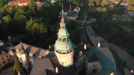 The-aerial-shot-of-the-magical-castle-in-Frydlant-in-Czech-Republic-during-sunset