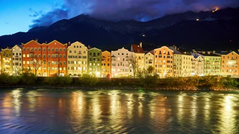 night-time-lapse-of-historic-building-facades-with-mountains-of-the-alps-in-the-background