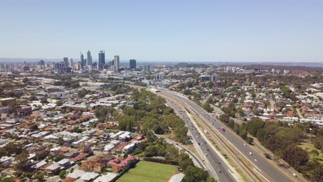 Aerial-tilt-up,-Mitchell-Freeway-leading-into-Perth-city,-Western-Australia
