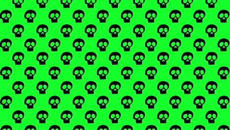 Halloween-Hintergrundanimation-Mit-Kleinen-Schwarzen-Totenköpfen,-Die-Sich-Nach-Oben-über-Grünem-Hintergrund-Bewegen