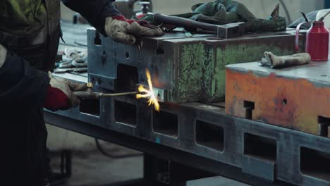 Worker-welding-machinery-in-an-industrial-workshop-4K-Slow-Motion-Shot-on-Canon-R5C
