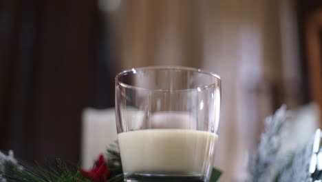 Slow-push-in-of-a-glass-a-traditional-holiday-drink-Christmas-eggnog-without-cinnamon