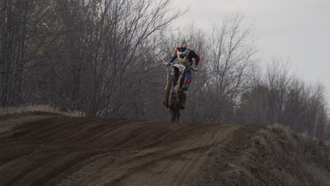 Motocross-big-jump-over-dirt-track-young-athlete