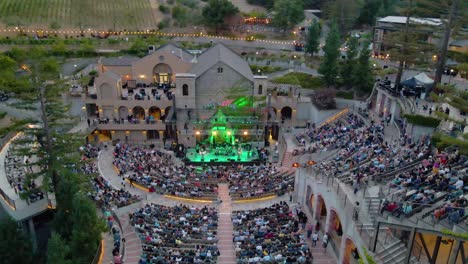 Aerial-drone-view-of-a-crowded-concert-bowl-venue,-at-the-mountain-winery-in-Saratoga,-California