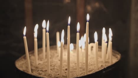 Candles-shining-and-oscillating-in-Church