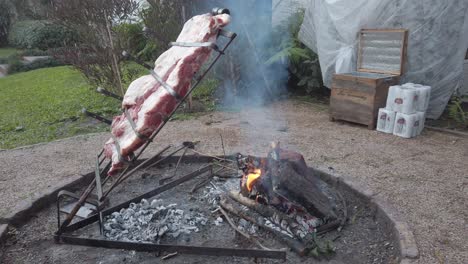 Pork-meat-cooking-over-smoke-on-open-air-fire