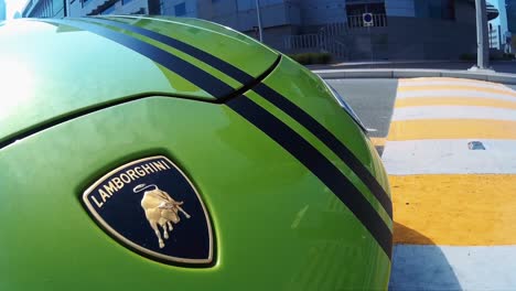 Green-Lamborghini-Huracan-driving-on-road-in-Dubai
