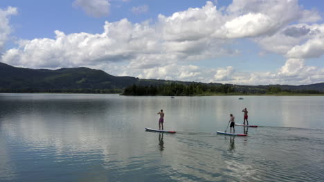 Stand-Up-Paddling-on-the-Kochelsee-near-Munich,-Germany-at-the-edge-of-the-Bavarian-Alps