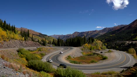 Wide-angle-view-of-cars-travelling-on-a-curvy-section-of-the-Million-Dollar-Highway-in-the-San-Juan-Mountains-of-Colorado