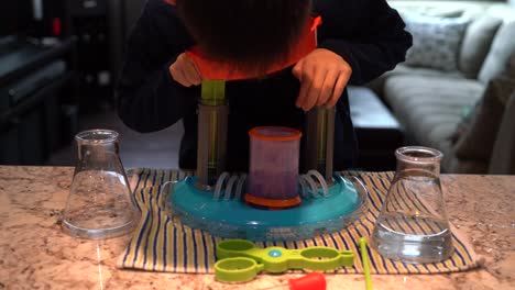 Boy-doing-a-bubbly-Science-experiment-using-the-Beaker-Creatures-Liquid-Reactor-Super-Lab