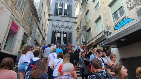 People-walk-up-the-stairs-at-the-Santa-Justa-Elevator,-Elevador-de-Santa-Justa-in-Lisbon,-Portugal