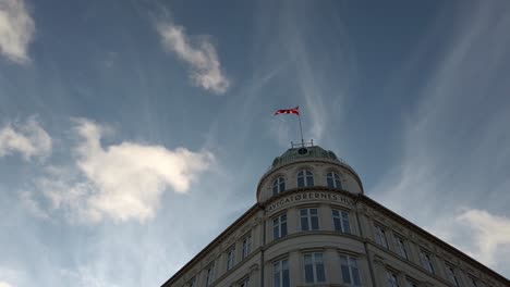 Flag-of-Denmark-waving-on-top-of-building-in-Copenhagen