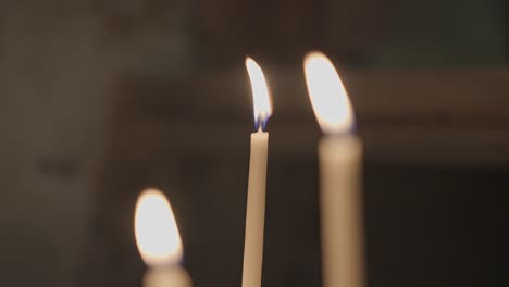 Candles-shining-and-oscillating-in-Church