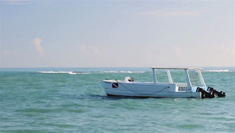 A-white-boat-floats-on-the-clear-Dominican-waters