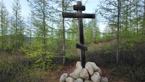 A-wooden-cross-stands-on-a-mound-of-rocks-in-this-video