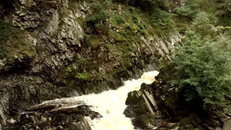 Aerial-view-of-rough-river-in-rocky-ravine