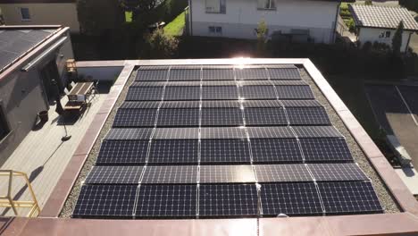 Drone-close-up-of-solar-panels-with-sunflair