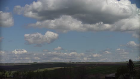 Timelapse-video-of-clouds-over-green-field