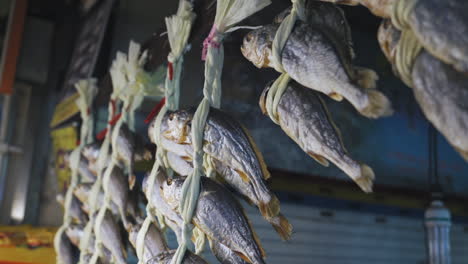 Dried-bulk-fish-at-Gwangjang-Market-in-Seoul-Korea,-medium-shot-truck-left-in-slow-motion