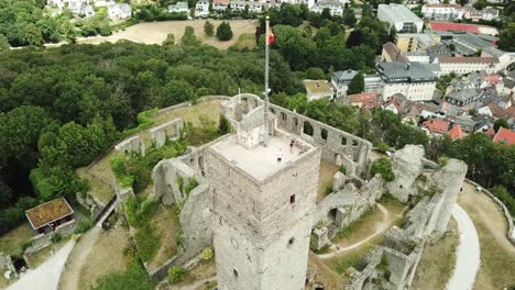 Castle-Königstein-on-a-Hill,-Germany,-flying-up-and-above