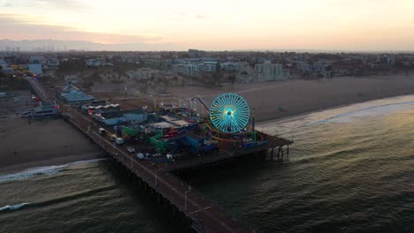 Aerial-pan-around-ferris-wheel-in-Santa-Monica-before-sunrise